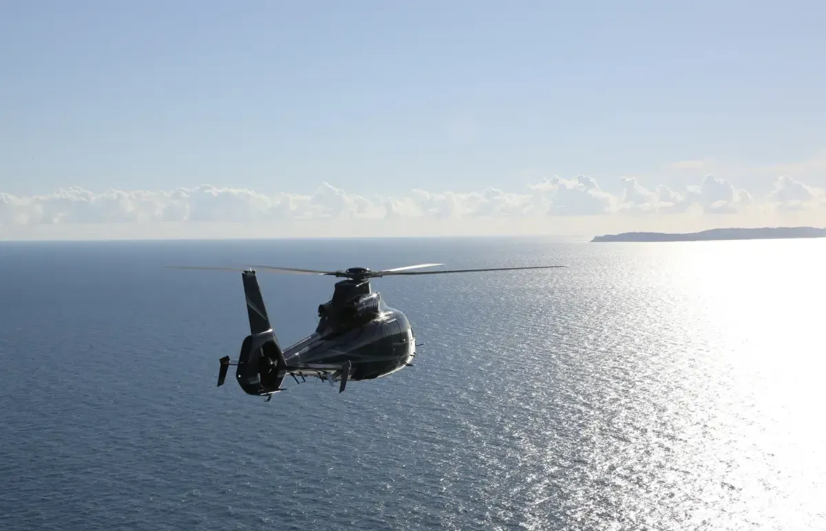 View of the Mediterranean coastline from inside a helicopter cabin