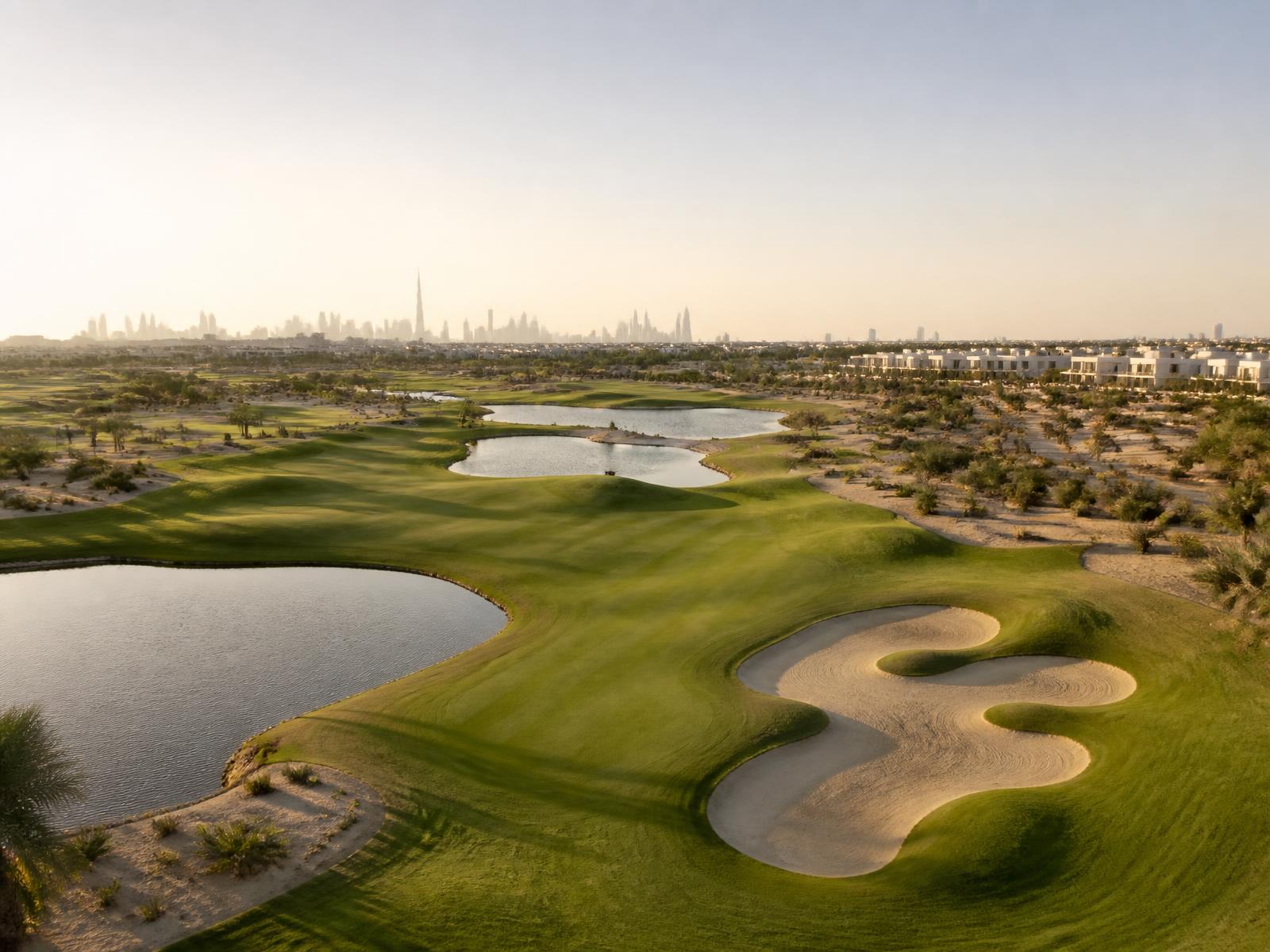 Championship golf course with fairways, bunkers and water in Dubai