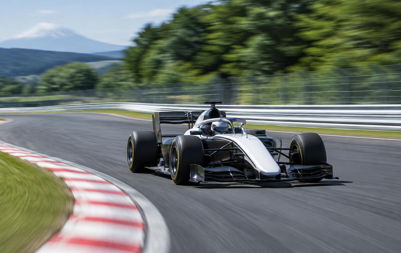 Racing car at high speed through a sweeping left-hand corner