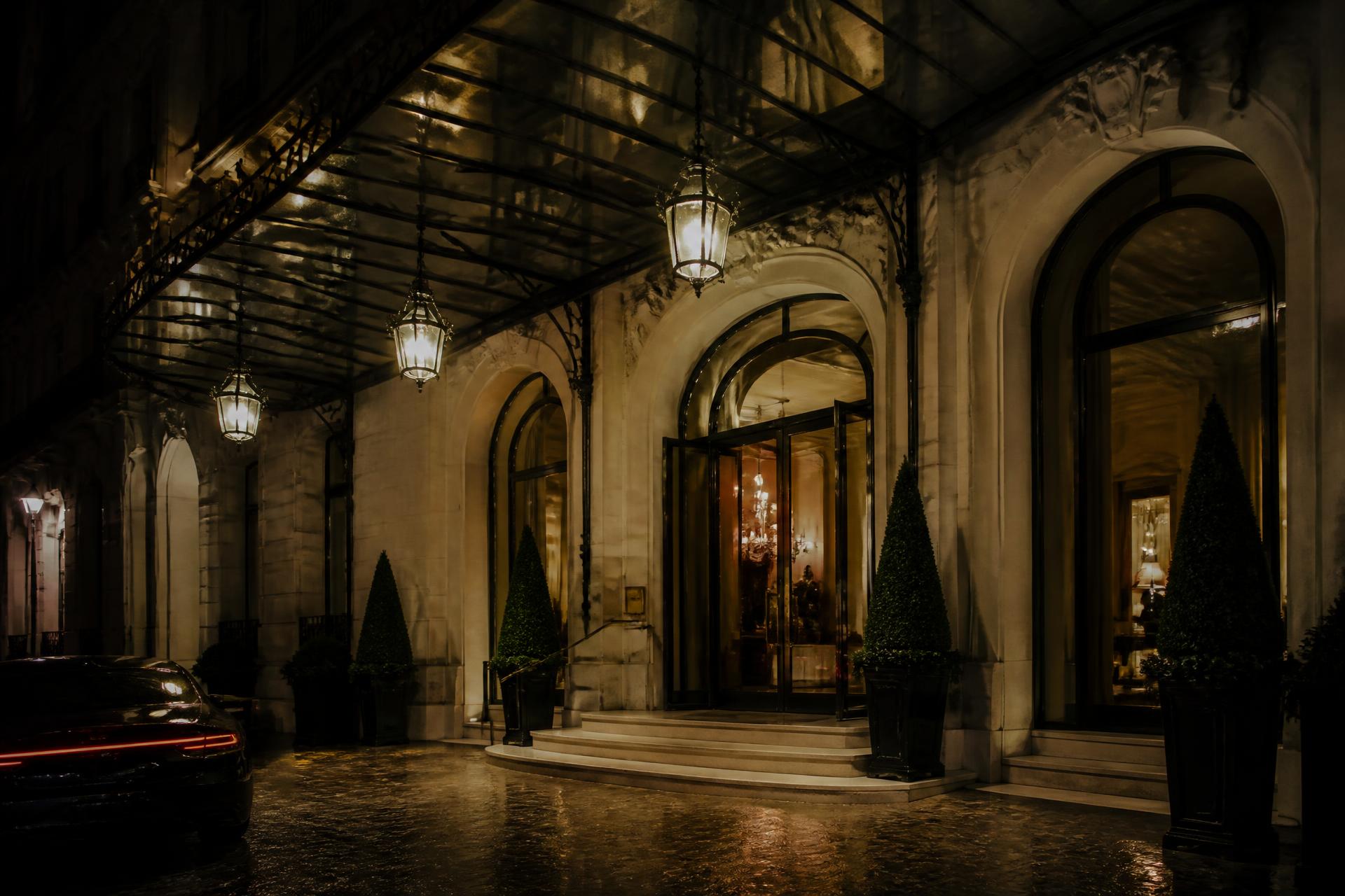 Palace hotel facade in Paris lit at dusk