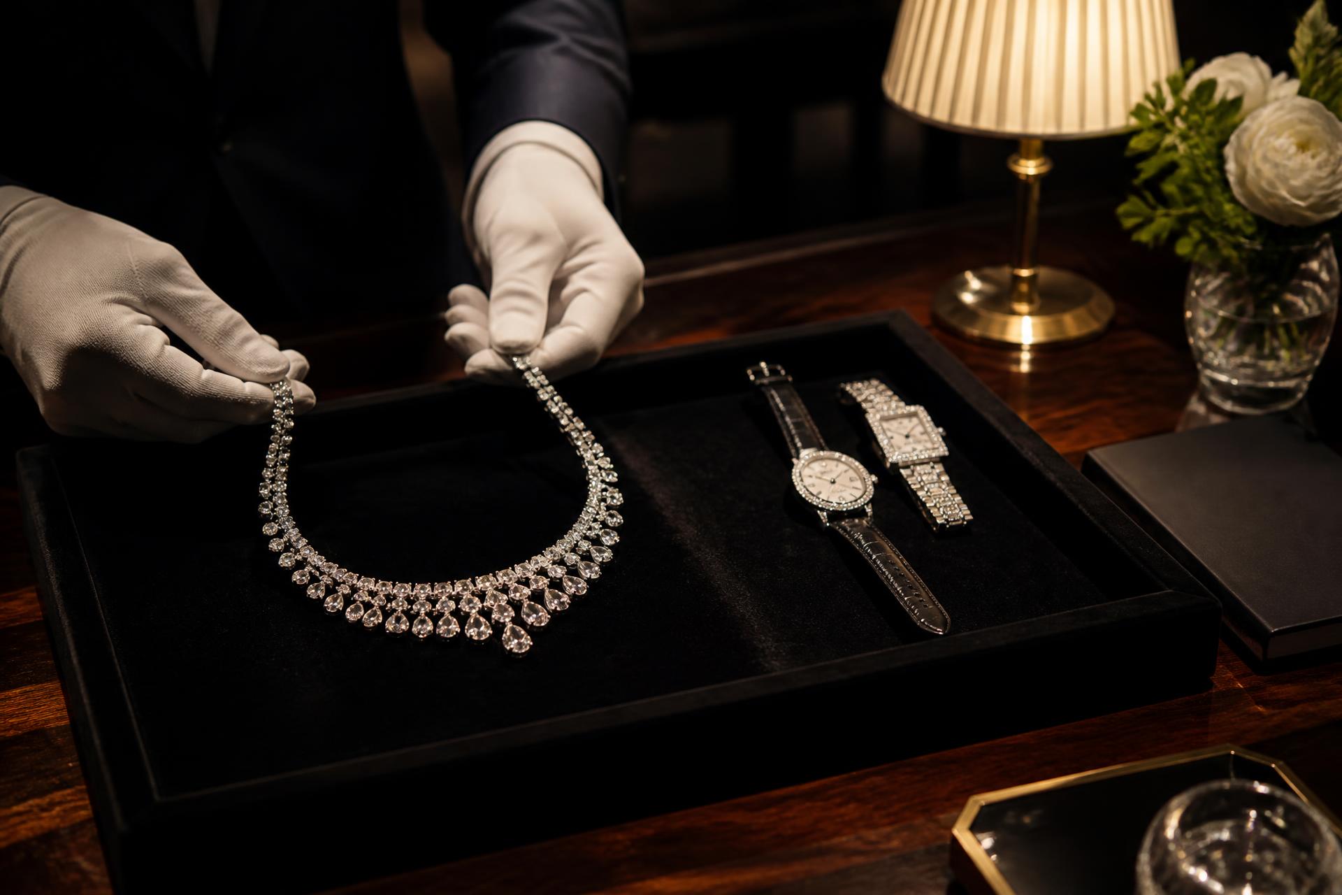 High jewellery pieces presented on a velvet tray in a Paris salon