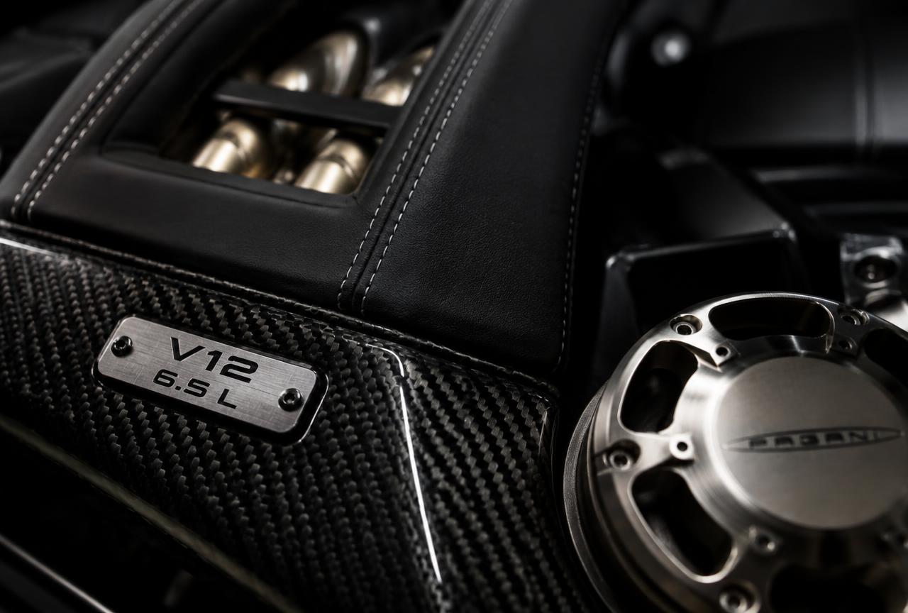 Macro detail of carbon fibre, stitched leather and titanium on an exceptional automobile