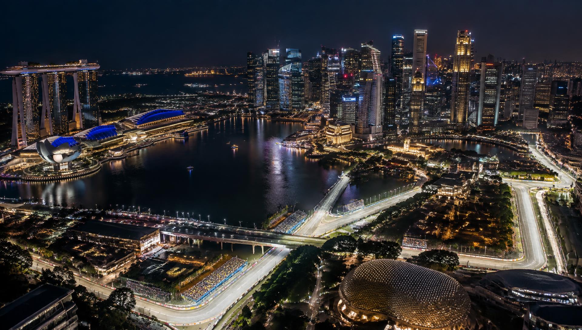 Singapore skyline reflected in Marina Bay late at night