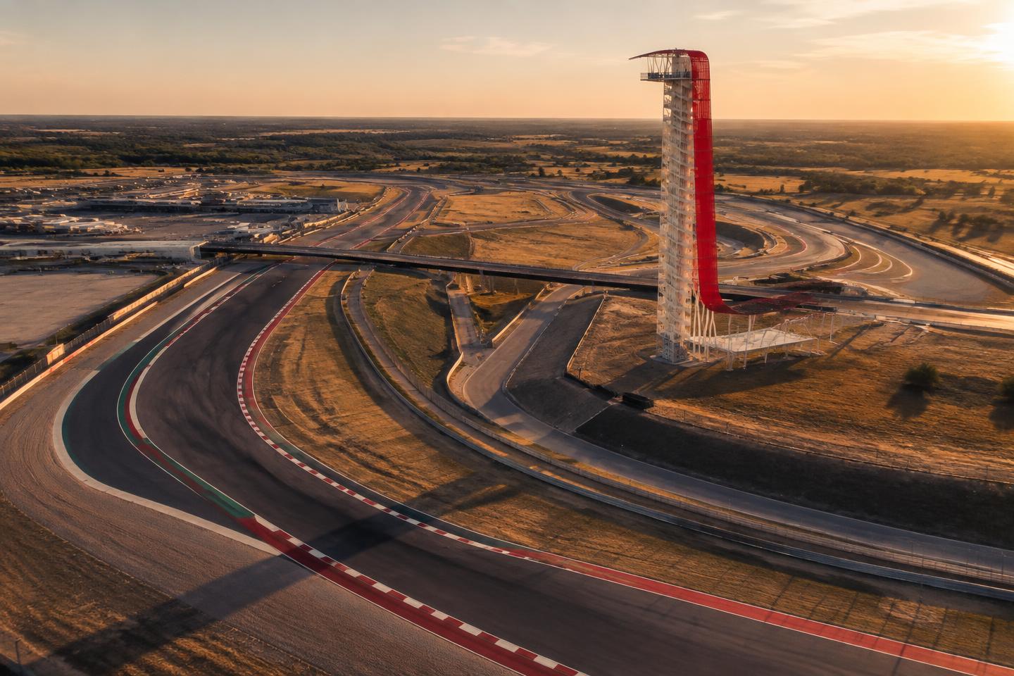 Circuit of The Americas asphalt and red kerbs winding through the Texan landscape