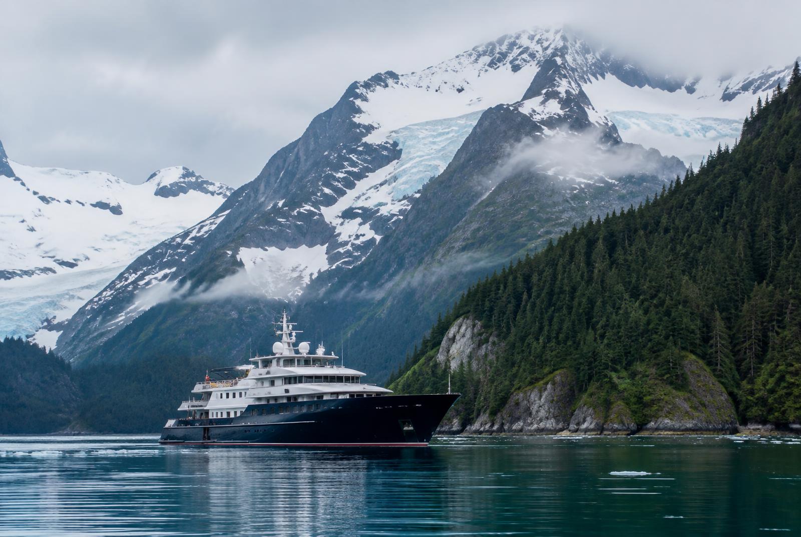 Explorer yacht in a glacial fjord in Alaska